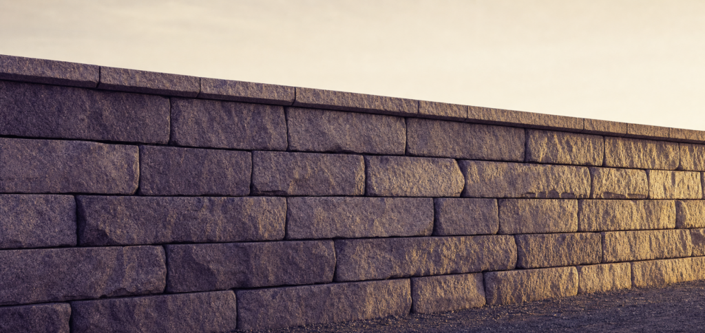 File: portfolio-construction-featured.png Alt text: Stacked granite foundation wall in warm light — featured image for Teachers' Path post on building portfolios on the foundation of a teacher pension